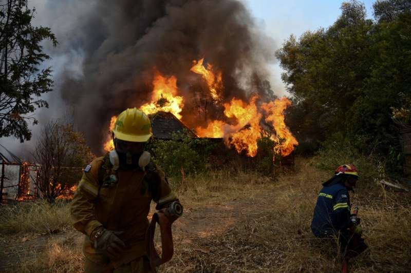 Nearly 300 firefighters, two water bomber planes and five helicopters battled a forest fire in Greece