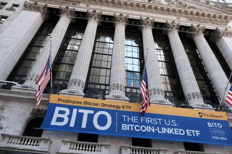 NEW YORK, NEW YORK - OCTOBER 19: A banner for the newly listed ProShares Bitcoin Strategy ETF hangs outside the New York Stock E