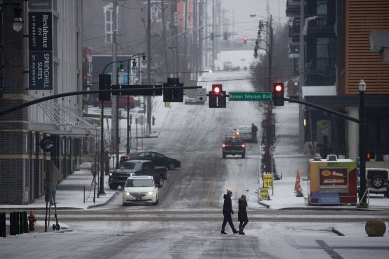 Pedestrians in Nashville, Tennessee, after freezing temperatures coated the city in ice