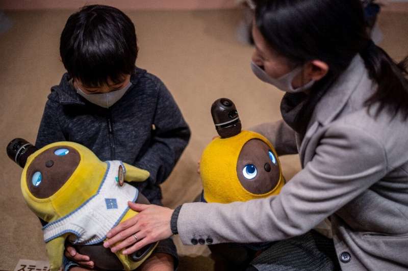 People can visit the Lovot Cafe near Tokyo to interact with the bots, which have big round eyes and penguin-like wings that flut