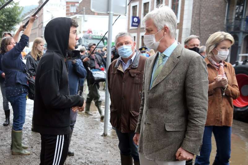 Philippe, king of the Belgains and Queen Mathilde of Belgium (R) were among the well-wishers who visited the devastated town of 