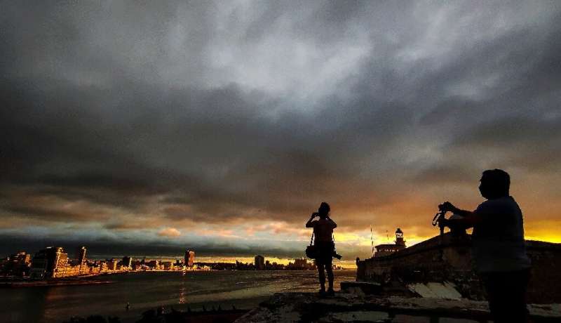 Photographers took pictures of the sunset before the passage of Tropical Storm Elsa in Havana