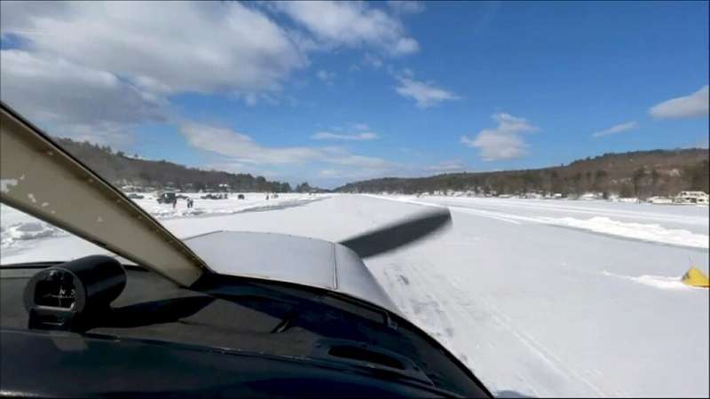 Pilot Scott Bahan in a Piper Cherokee small plane as it taxis to the icy runway in Alton, New Hampshire on Lake Winnipesaukee