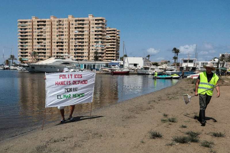 'Politicians you let the Mar Menor die' proclaims a banner on the beach