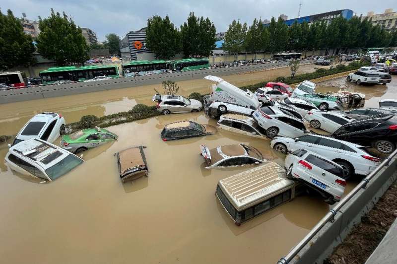Residents were trapped in subway carriages, underground car parks, and tunnels as central China was hit by a year's worth of rai