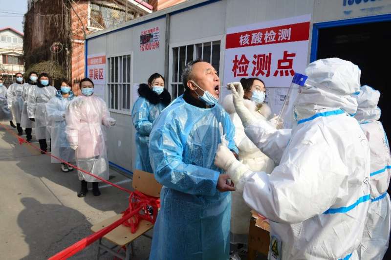 Residents of  Shijiazhuang in northern Hebei, China line up for Coronavirus tests