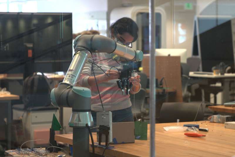 Robotic arm fuses data from a camera and antenna to locate and retrieve items