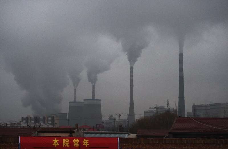 Smoke belches from a coal-fueled power station near Datong, in China's northern Shanxi province, in 2015