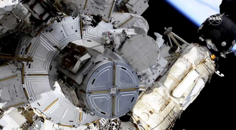 Spacewalking astronauts boosting station's solar power