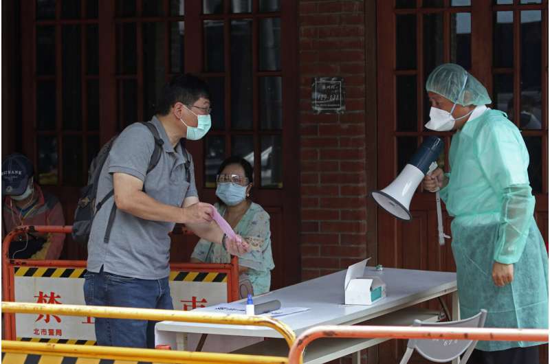 Taiwan struggles with testing backlog amid largest outbreak