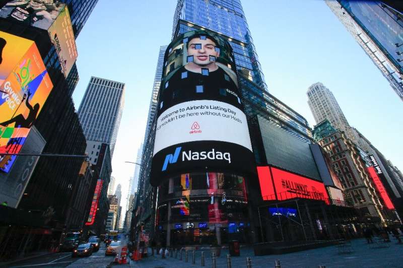 The Airbnb logo is displayed on the Nasdaq digital billboard in Times Square in New York on December 10, 2020