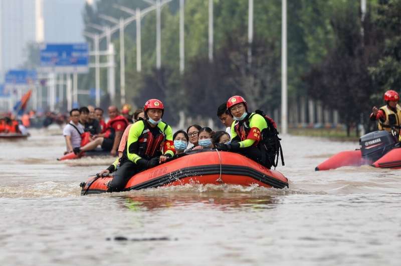 The death toll from floods in central China rose to 302 after torrential downpours dumped a year's rain on a city in just three 