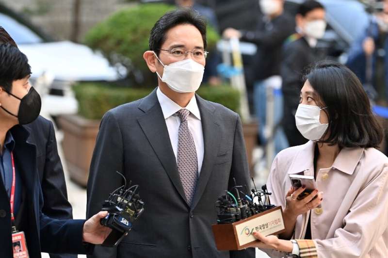 The earnings report comes a day after Samsung scion Lee Jae-yong (C) was convicted of illegally using the anaesthetic propofol a