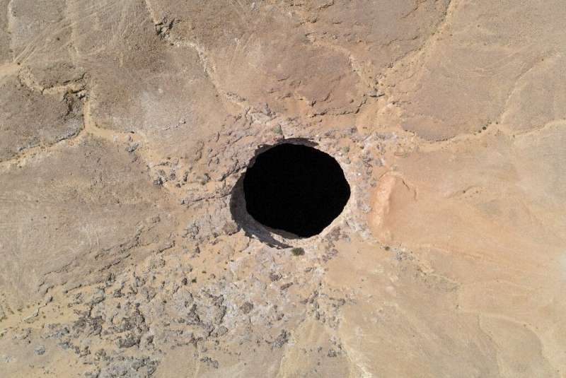 The giant hole in the desert of Al-Mahra province is 30 metres (nearly 100 feet) wide and thought to be anywhere between 100 and