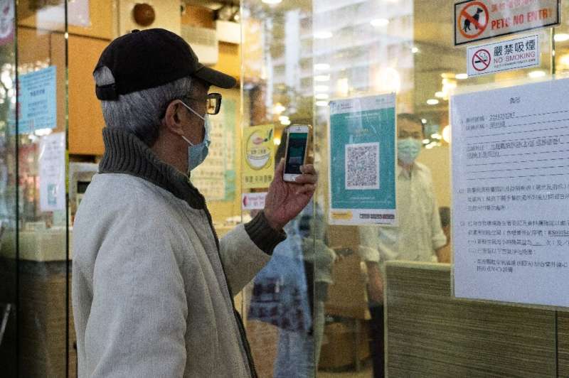 The Hong Kong government has made its coronavirus tracing app mandatory for most adults in 18 types of premises, including bars 