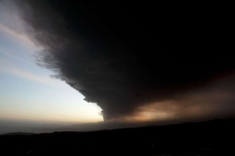 The sun sets in a sky dusted with ash over Màrdalsjškull, 20 km east from Iceland's Eyjafjoell volcano, on May 5, 2010 