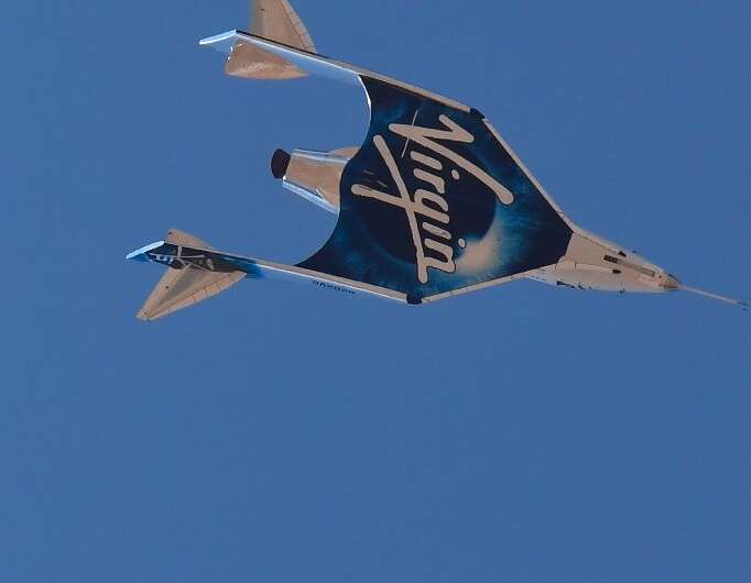 The Virgin Galactic SpaceShipTwo space plane Unity returns to Earth