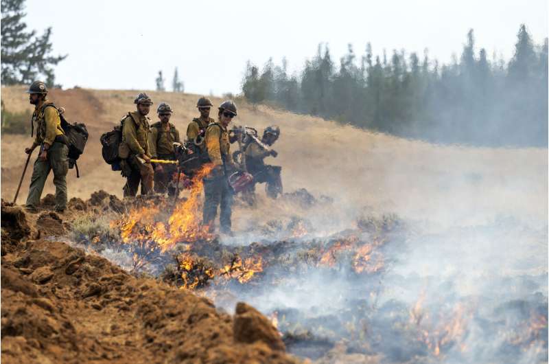 Thousands of firefighters battle big blazes across the West