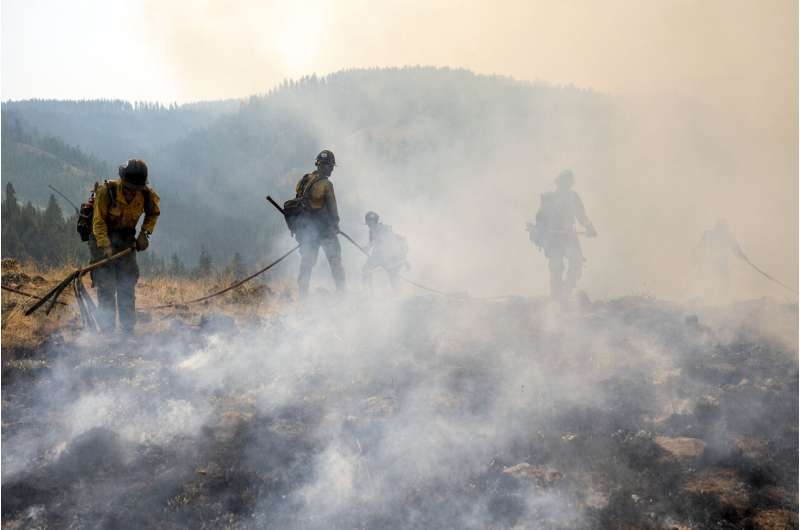 Thousands of firefighters battle big blazes across the West