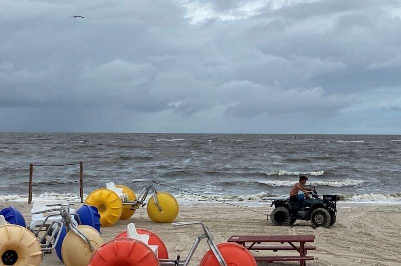 Tropical weather lashes Gulf Coast with brisk winds, rain