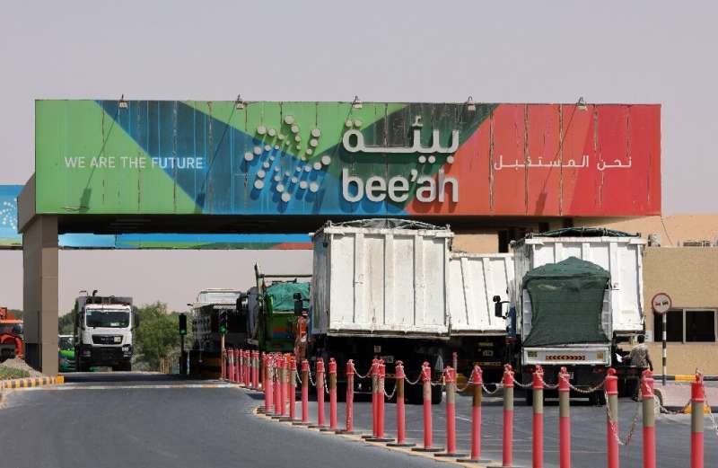 Trucks drive into the Bee'ah waste management site in the Gulf emirate of Sharjah; as the UAE has grown waste production has mul