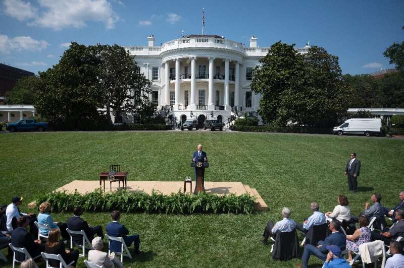 US President Joe Biden announced a new target for zero-emission car sales on the South Lawn of the White House in Washington on 