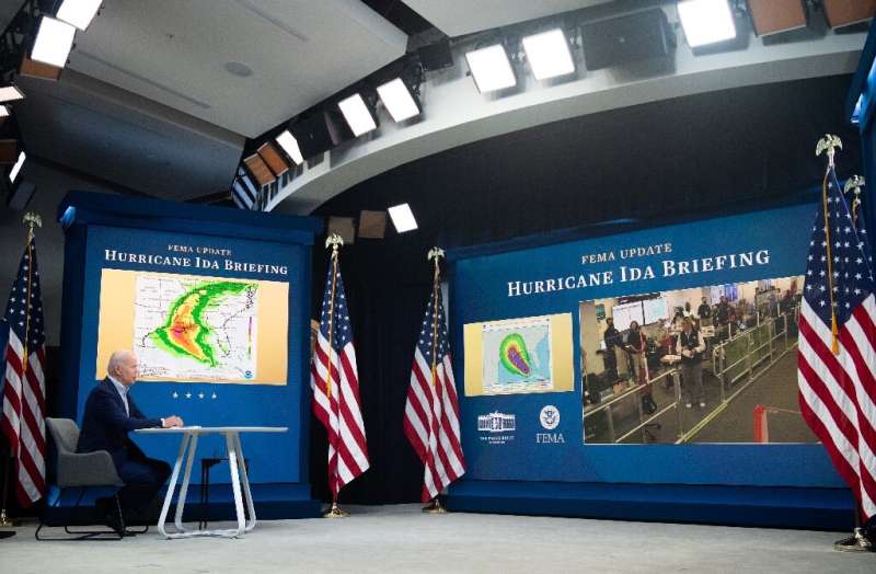 US President Joe Biden is seen receiving a briefing by emergency management officials at the White House on August 28, 2021