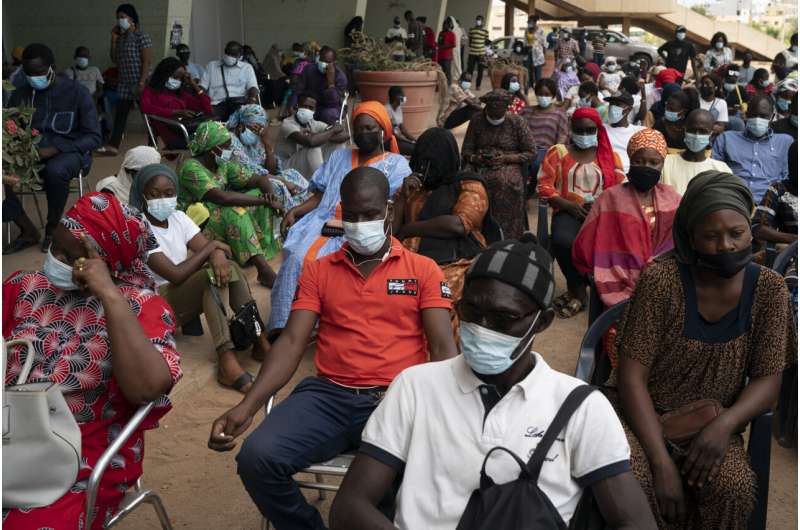 West African health officials race to vaccinate amid spikes