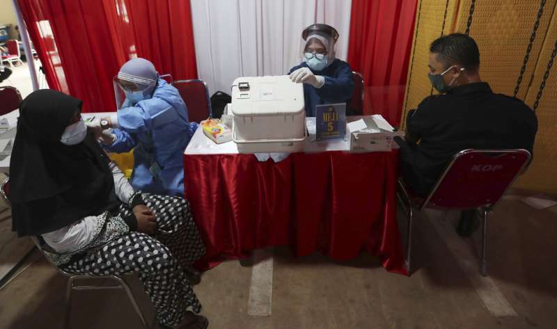 WHO warns of fresh Indonesia surge fed by virus variants