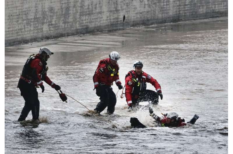 2 people, dog rescued from river as storm douses California