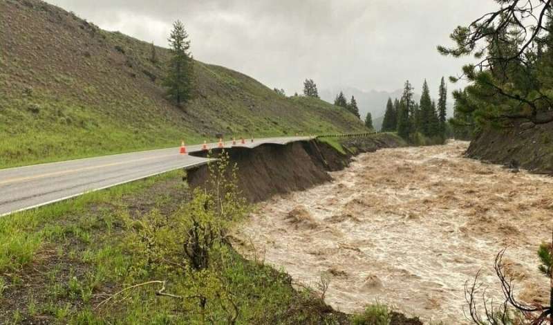 A flooded river in Yellowstone National Park has swept away stretches of road after unprecendented rainfall