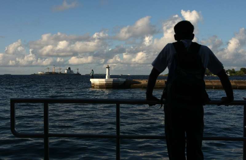 A man looks out to sea in October 2008 in Male, the capital of the Maldives, which is among several island nations the UN has sa