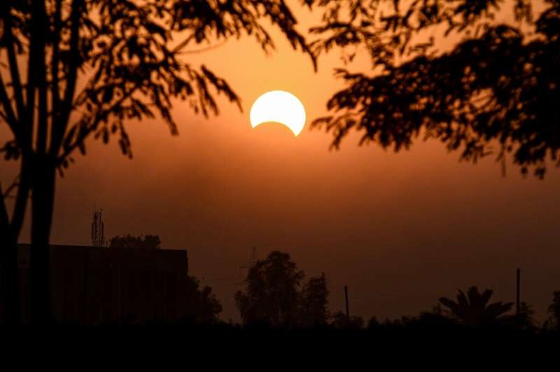A partial solar eclipse in Iraq in 2019. Tuesday's eclipse is not expected to darken the sky