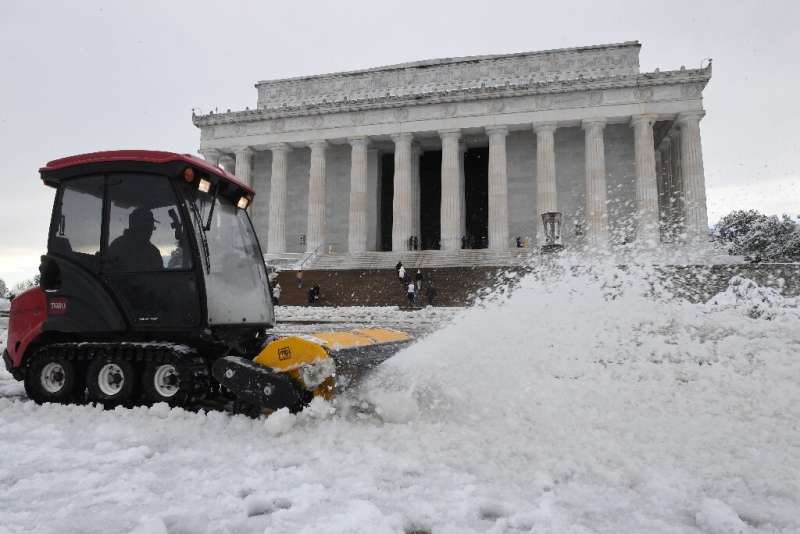 A snow-plough removes snow on the grounds of the Lincoln Memorial  after a winter storm over the capital region on January 3, 20