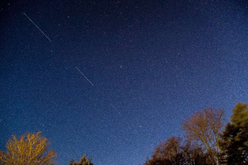 A SpaceX Starlink satellite is seen passing in the night sky in Denmark in April 2020