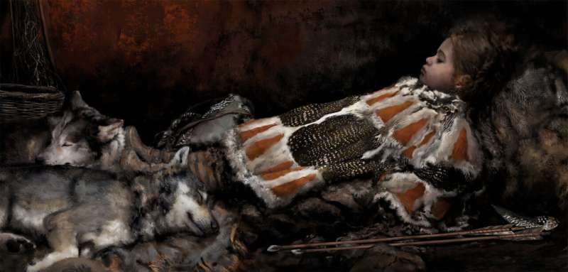 A stone age child buried with bird feathers, plant fibres and fur