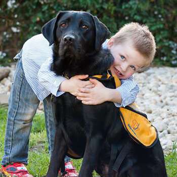 A wet nose and a wagging tail opens a new world for autistic kids