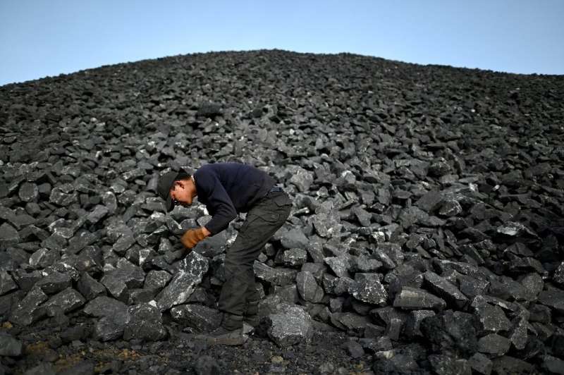 A worker sorts coal near a mine at Datong in China's northern Shanxi province