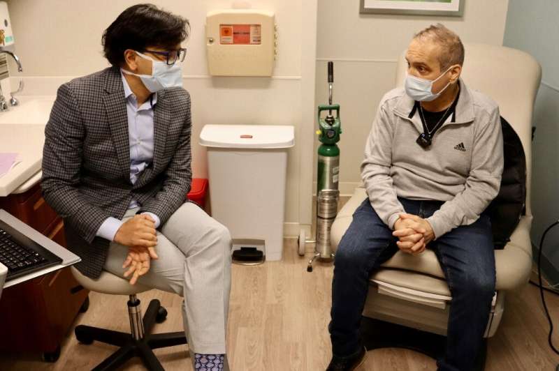 Albert Khoury (R) speaks about his new lungs with surgeon Ankit Bharat in Chicago in January 2022, in a handout image courtesy o