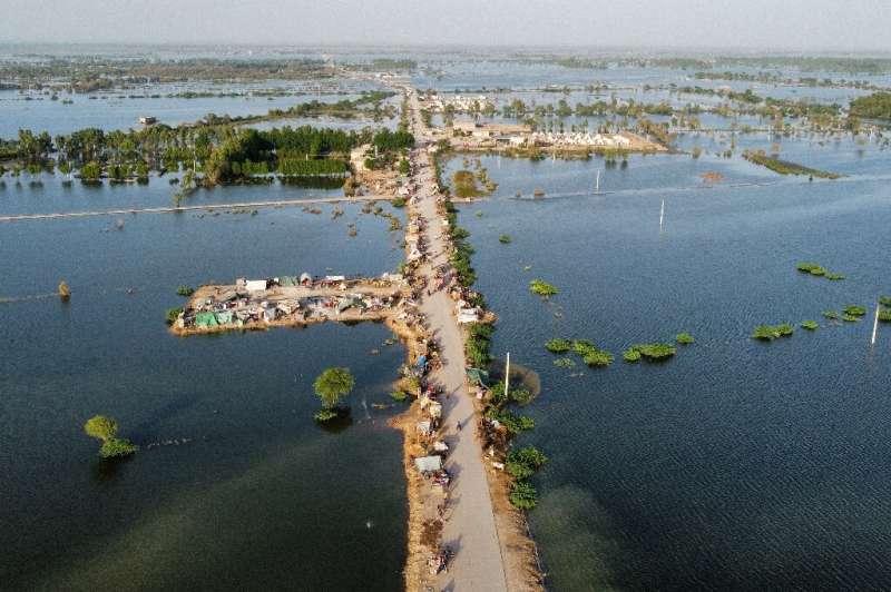 An aerial photograph shows makeshift tents along a road in a flooded part of Jaffarabad district in Balochistan