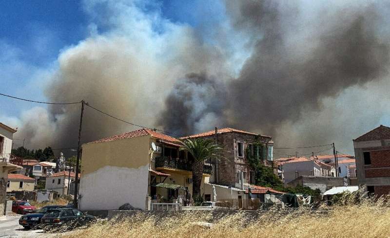 Around 200 people were ordered to leave the Lesbos village of Vryssa on Sunday to escape the flames