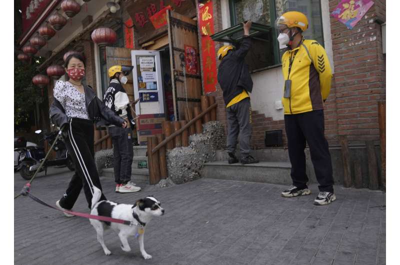 Beijing locks down more people in China's 'zero-COVID' fight