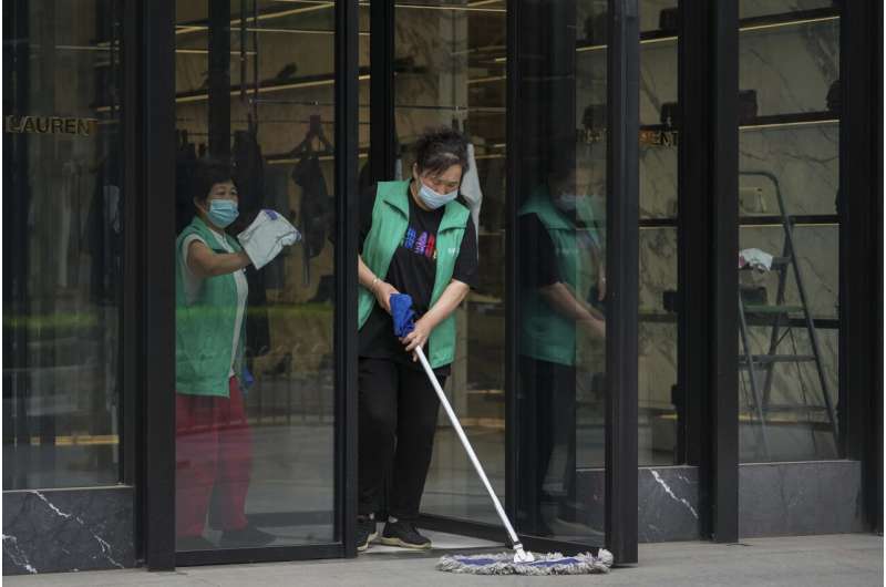 Beijing, Shanghai ease COVID restrictions as outbreaks fade