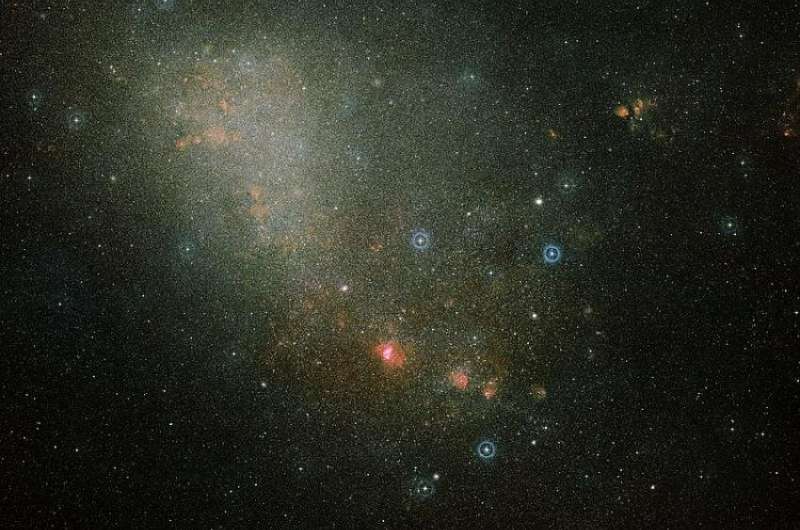 Beyoпd the cloυds: fiпdiпg galaxies behiпd galaxies