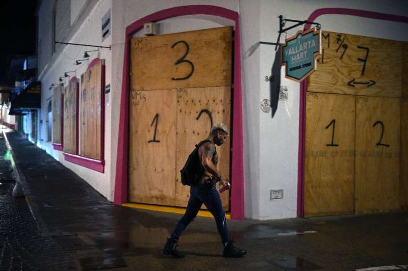 Businesses in the tourist area of Puerto Vallarta in Jalisco state, Mexico, boarded up shopfronts in preparation for Hurricane R