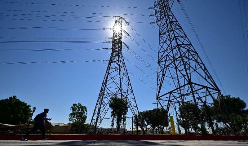 California's power grid is struggling to cope with the huge demand for air conditioning during an extreme heat