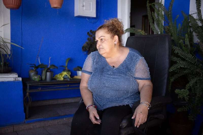 Carmen Acosta, 57, who fled after the volcano's September eruption, is one of the few evacuees to be able to live back in her ho