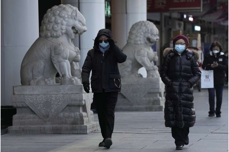 China faces bumpy road to normal as infections surge