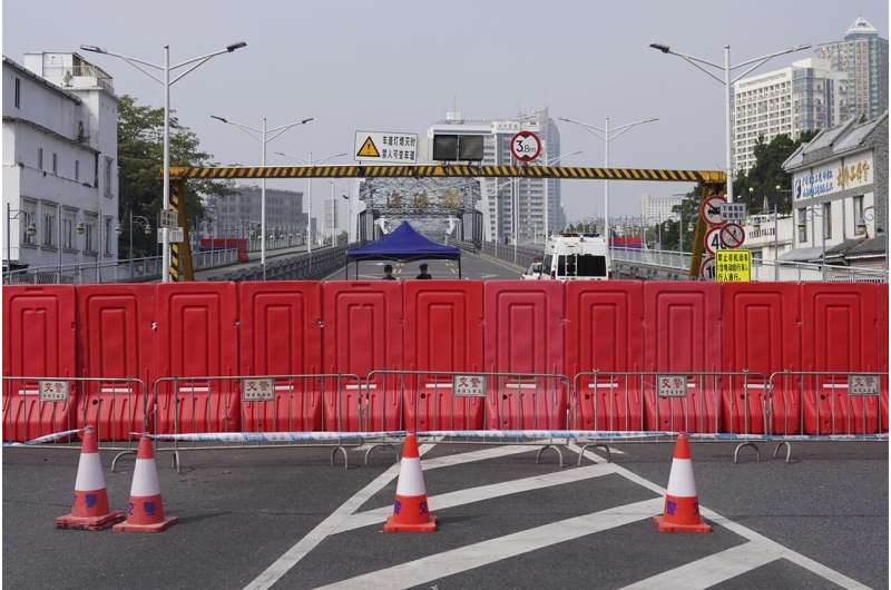 China tightens restrictions as rise in virus cases reported