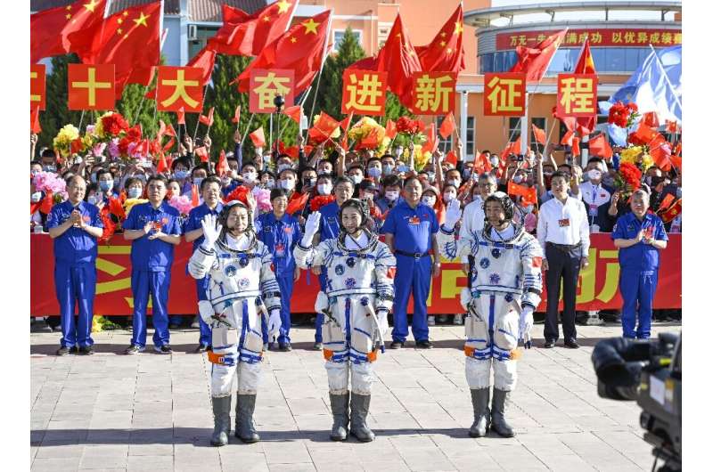 Chinese astronauts Cai Xuzhe, Chen Dong and Liu Yang (L to R) take part in a ceremony prior to the launch of the Shenzhou-14 mis